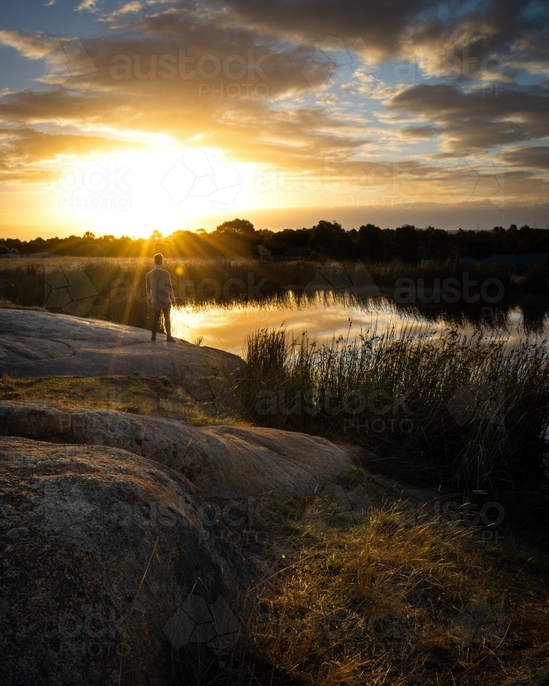 Relaxing Beside a Lake at Sunset - Australian Stock Image