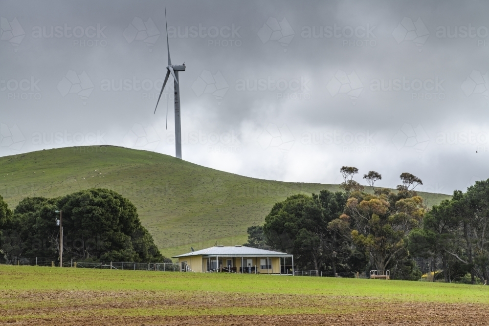 Remote house with wind turbine - Australian Stock Image