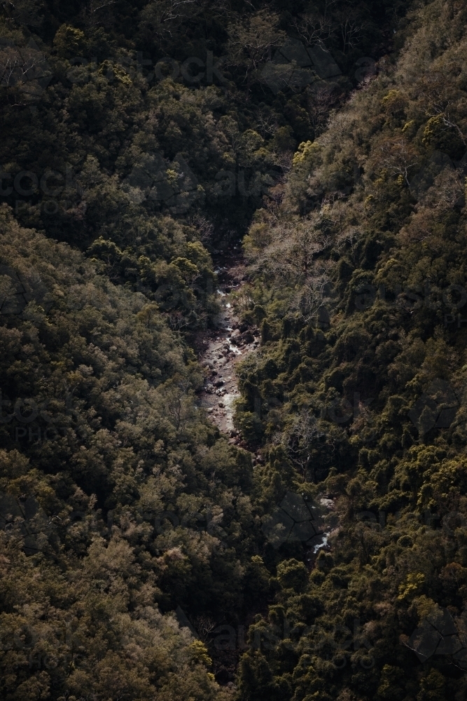 Remote river at the bottom of a valley at Kanangra Walls Lookout, NSW - Australian Stock Image