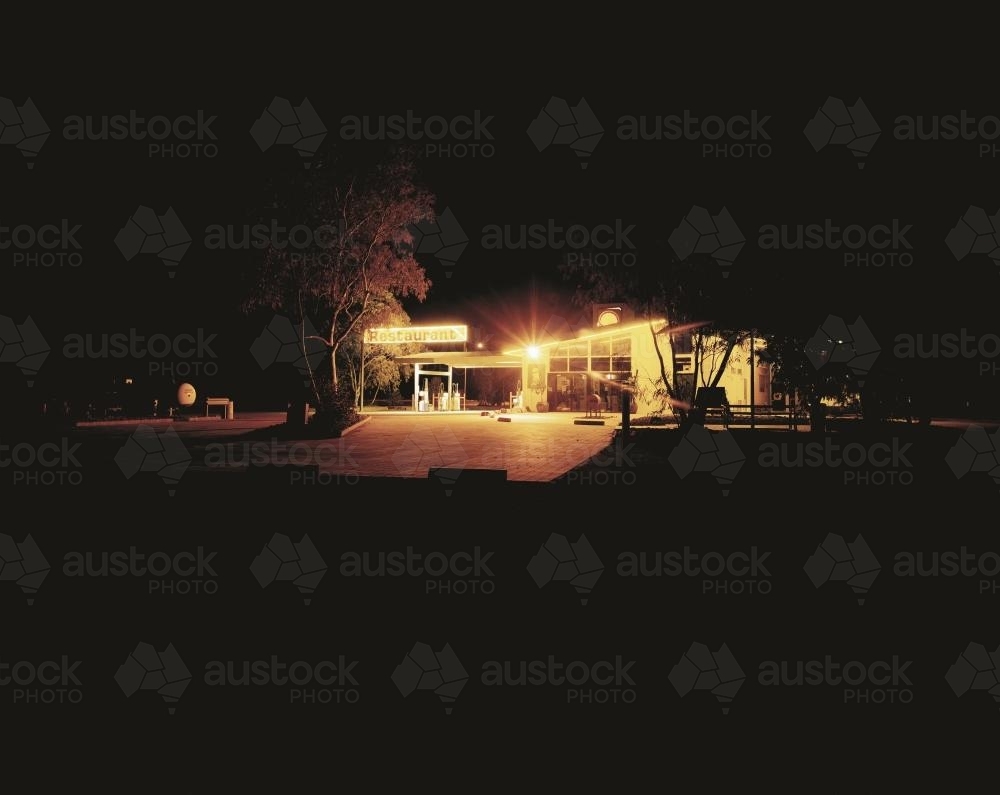 Remote service station lit up at night - Australian Stock Image