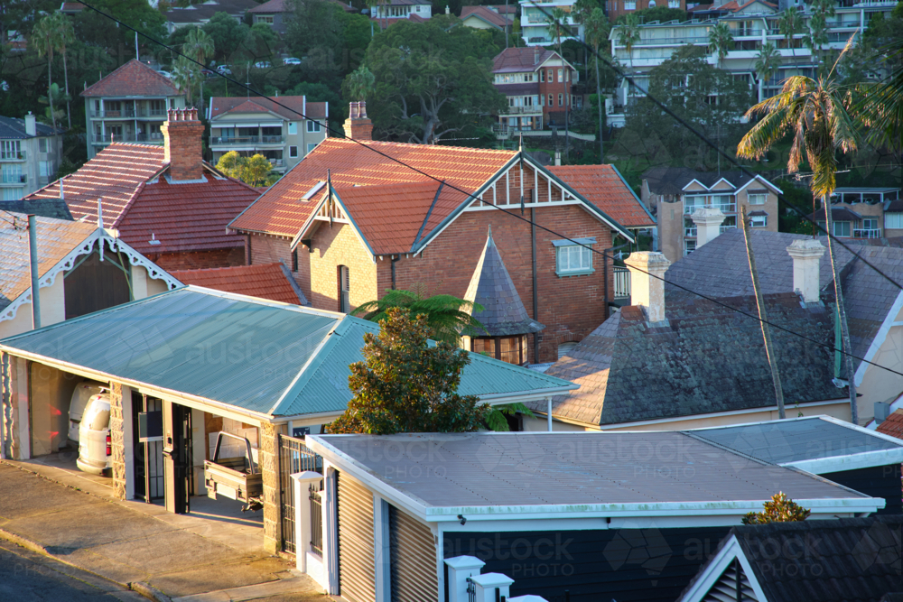 Residential area with multiple houses and buildings with various roof types. - Australian Stock Image