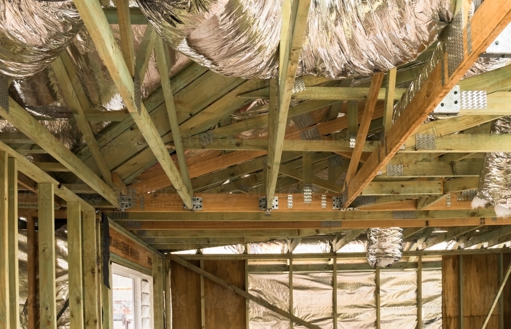 Residential building extension showing air conditioning ducts, timber framing and wall linings - Australian Stock Image