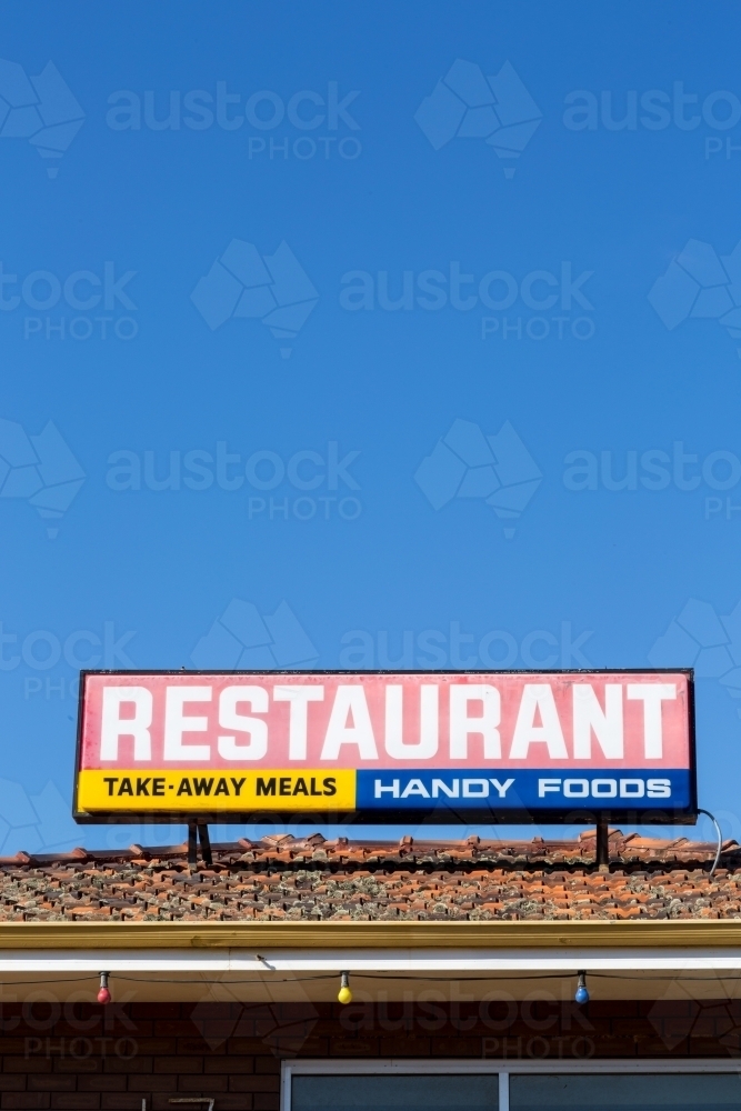 Restaurant sign, with blue sky - Australian Stock Image