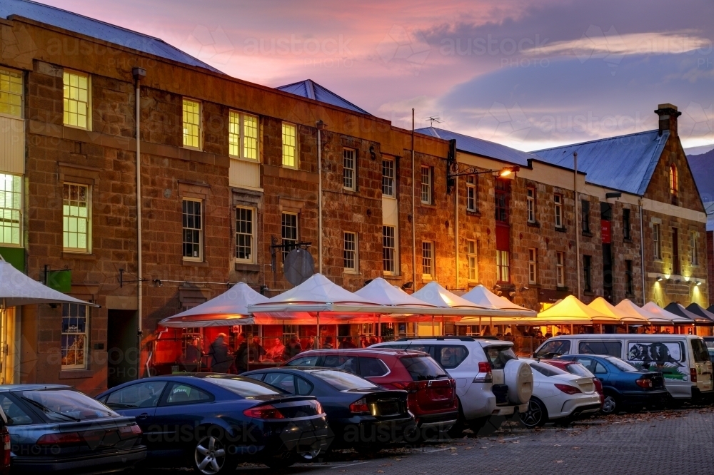 Restaurants and bars streetscape with parked cars and historic buildings on Salamanca Place, Hobart. - Australian Stock Image