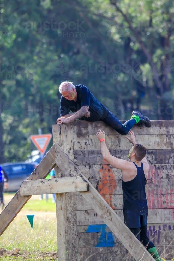 Retiree completing fitness course - Australian Stock Image