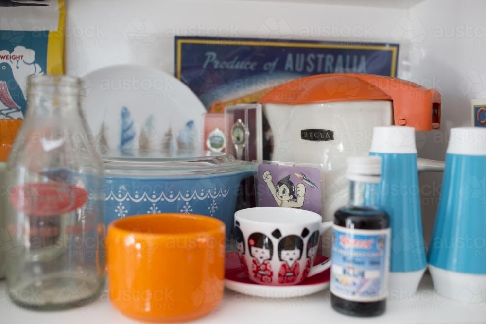 Retro collection on shelf in kitchen - Australian Stock Image