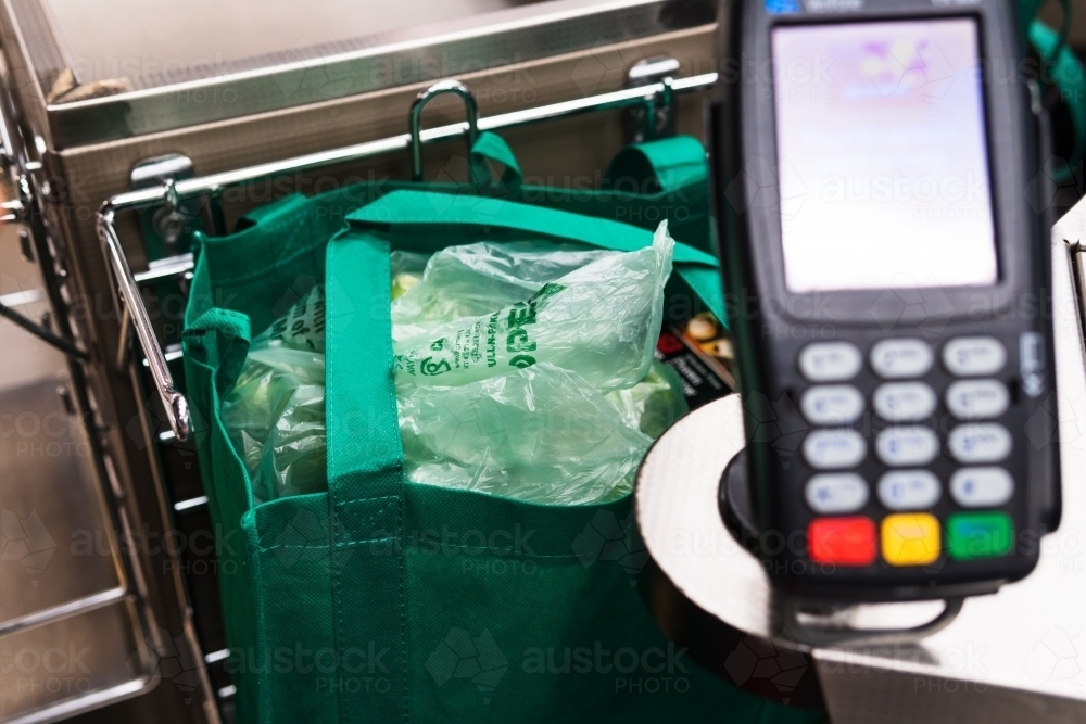 Reusable shopping bags for sale in Supermarket. - Australian Stock Image