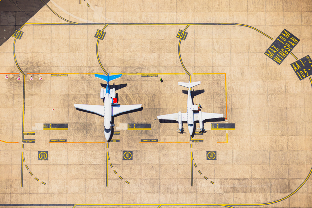 RFDS Pilatus PC-24 and King Air B300 parked at Sydney Airport - Australian Stock Image