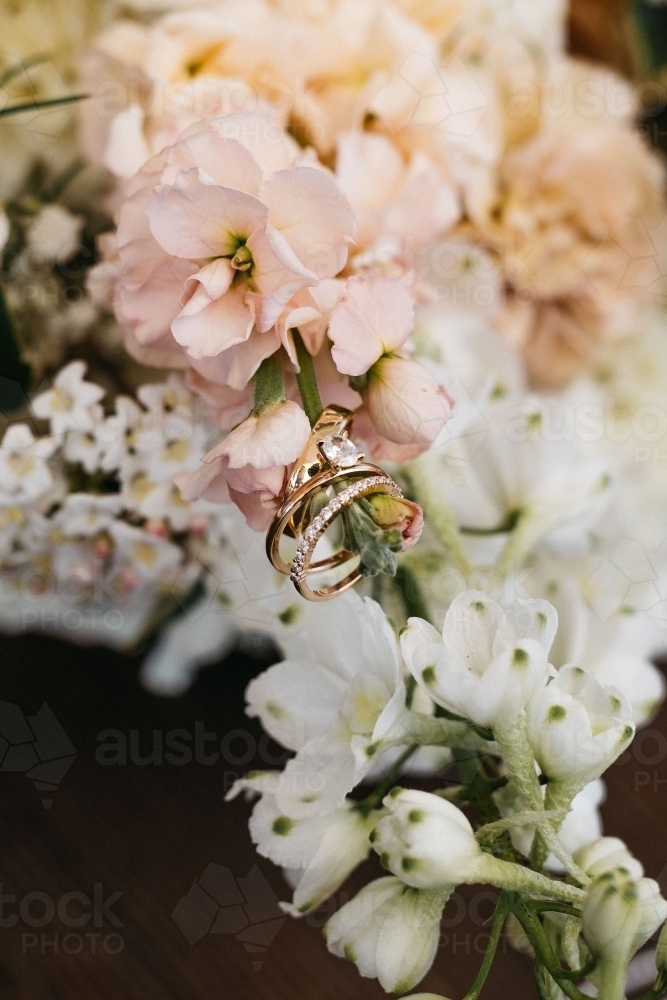 Rings on wedding flowers - Australian Stock Image