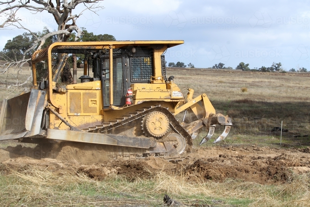 Ripping up rabbit burrows - Australian Stock Image