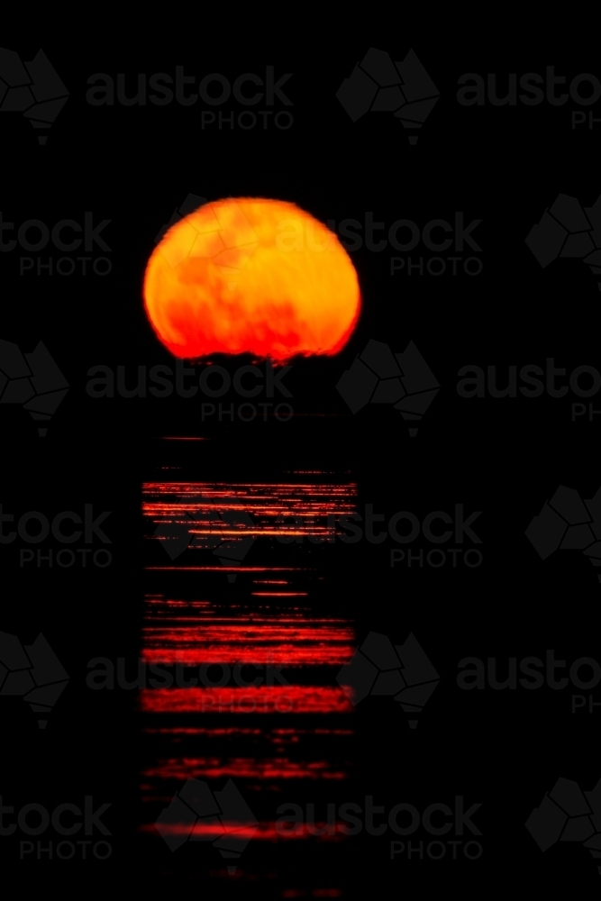 Ripples of light across water like a staircase to the moon - Australian Stock Image
