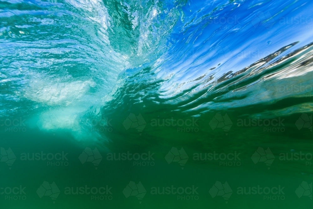 Ripples on the surface of green water - Australian Stock Image