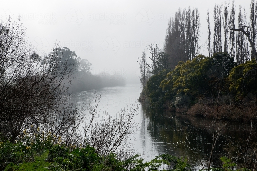 river bend on misty morning - Australian Stock Image