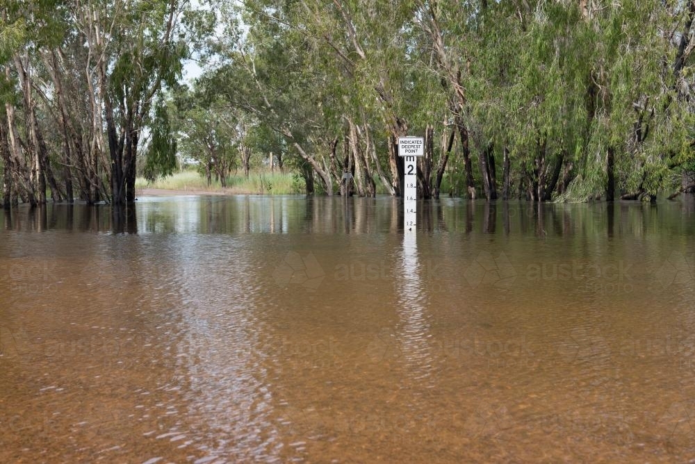 River flood over road - Australian Stock Image