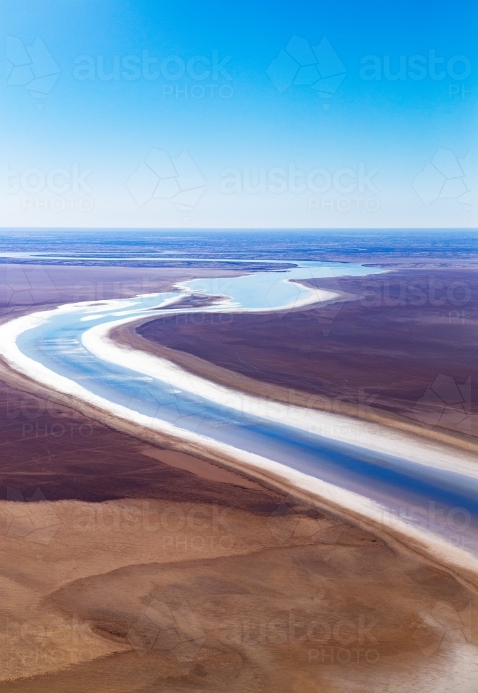 river snaking through brown landscape - Australian Stock Image
