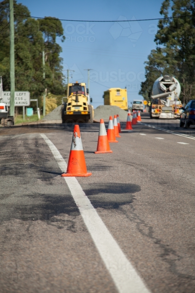 Road cones beside resurfacing roadwork - Australian Stock Image