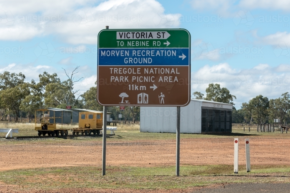 Road sign and structures in regional area - Australian Stock Image