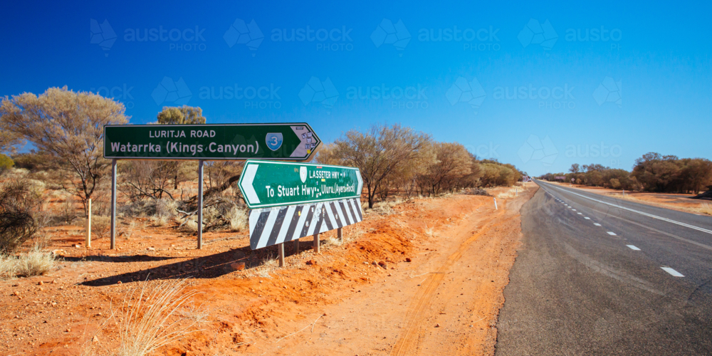 Road sign directing towards Uluru and Kings Canyon in NT - Australian Stock Image