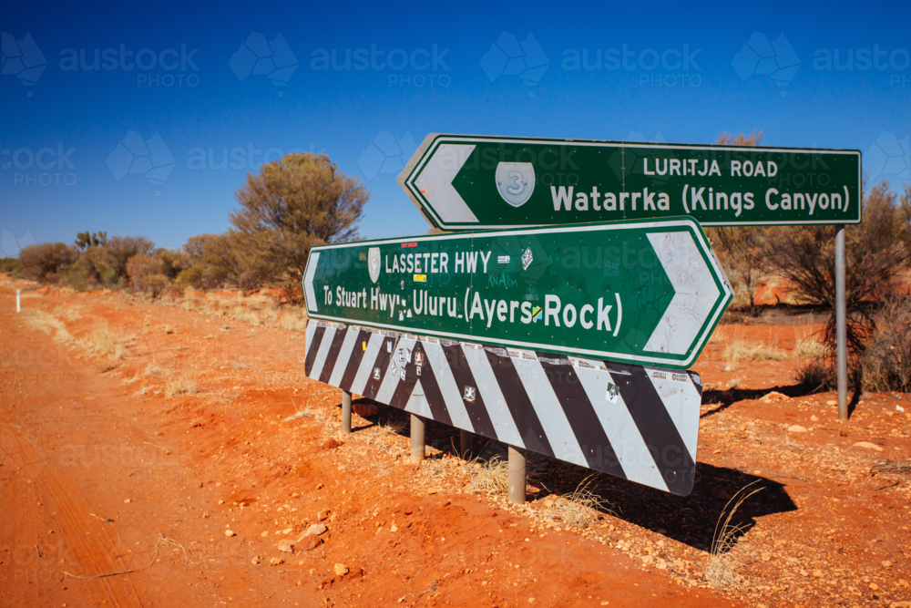 Road sign directing towards Uluru and Kings Canyon, NT - Australian Stock Image
