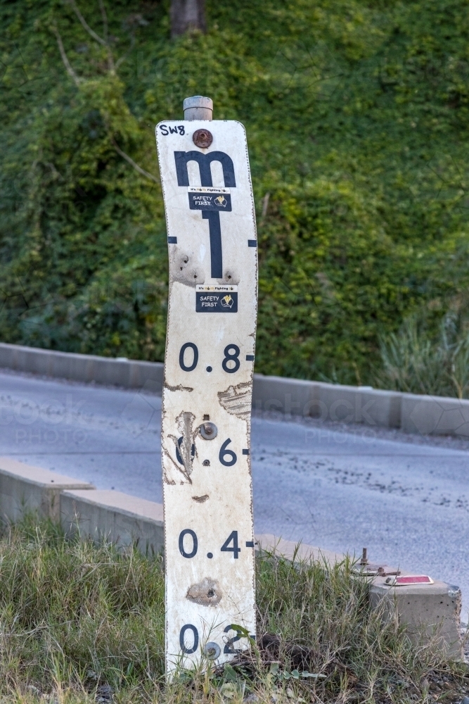 Image of Road subject to flooding sign depth indicator - Austockphoto