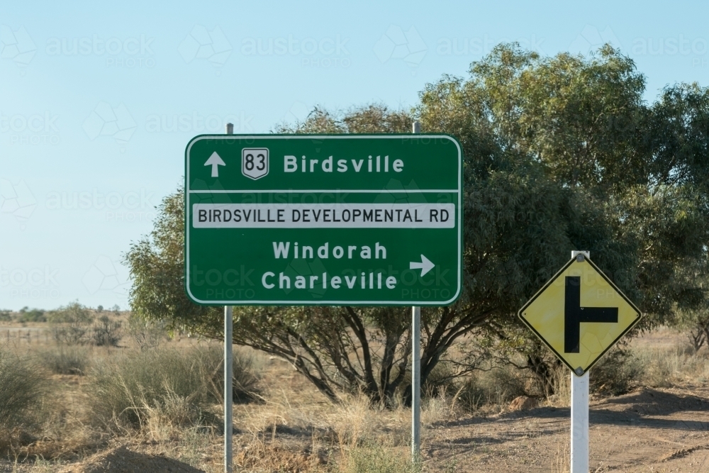 Road to Birdsville sign and right hand turn sign - Australian Stock Image