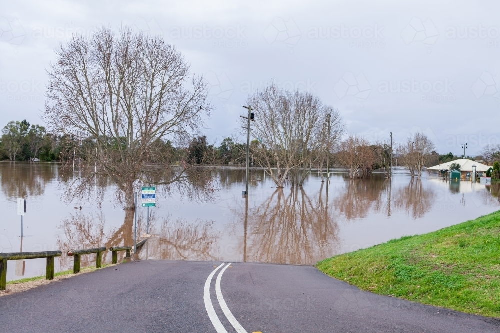 Image of Road to park covered in floodwater during flooding natural