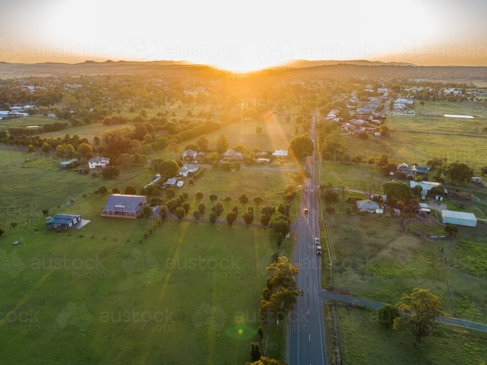 Image of Road to the sunset in australian countryside with rural town