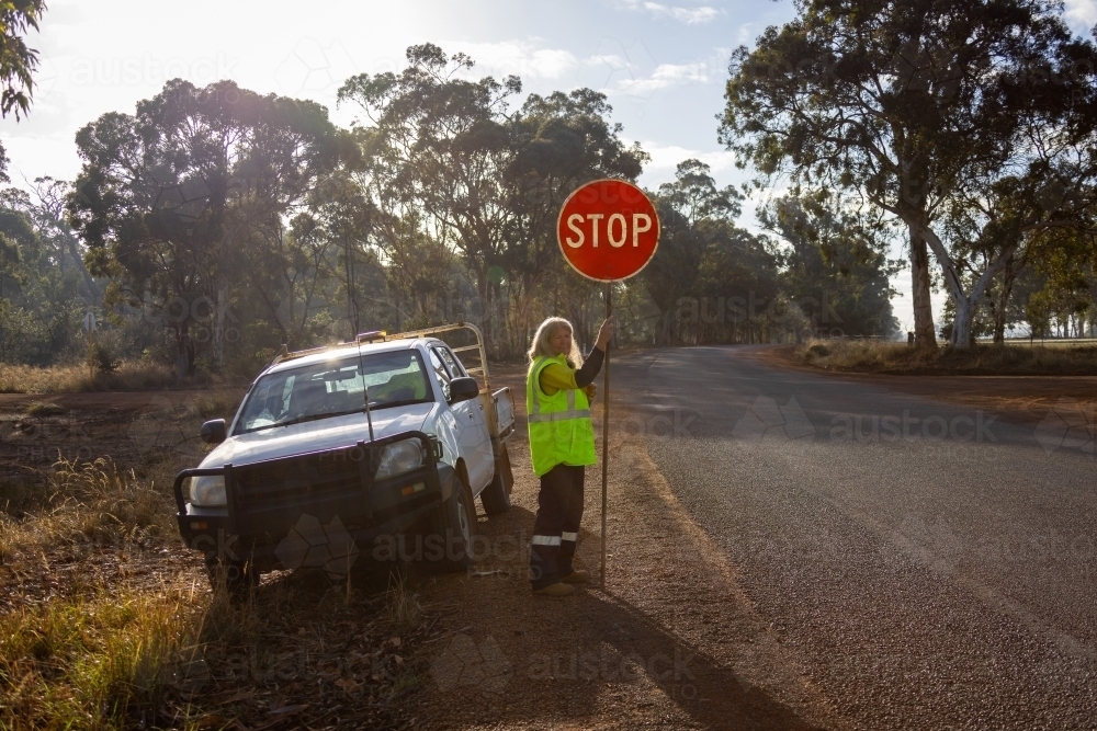 Road Traffic Controller on Australian Country Road - Australian Stock Image