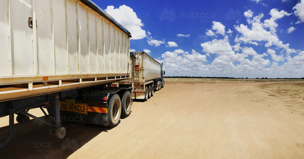 Road Train in bright sunlight in the outback - Australian Stock Image