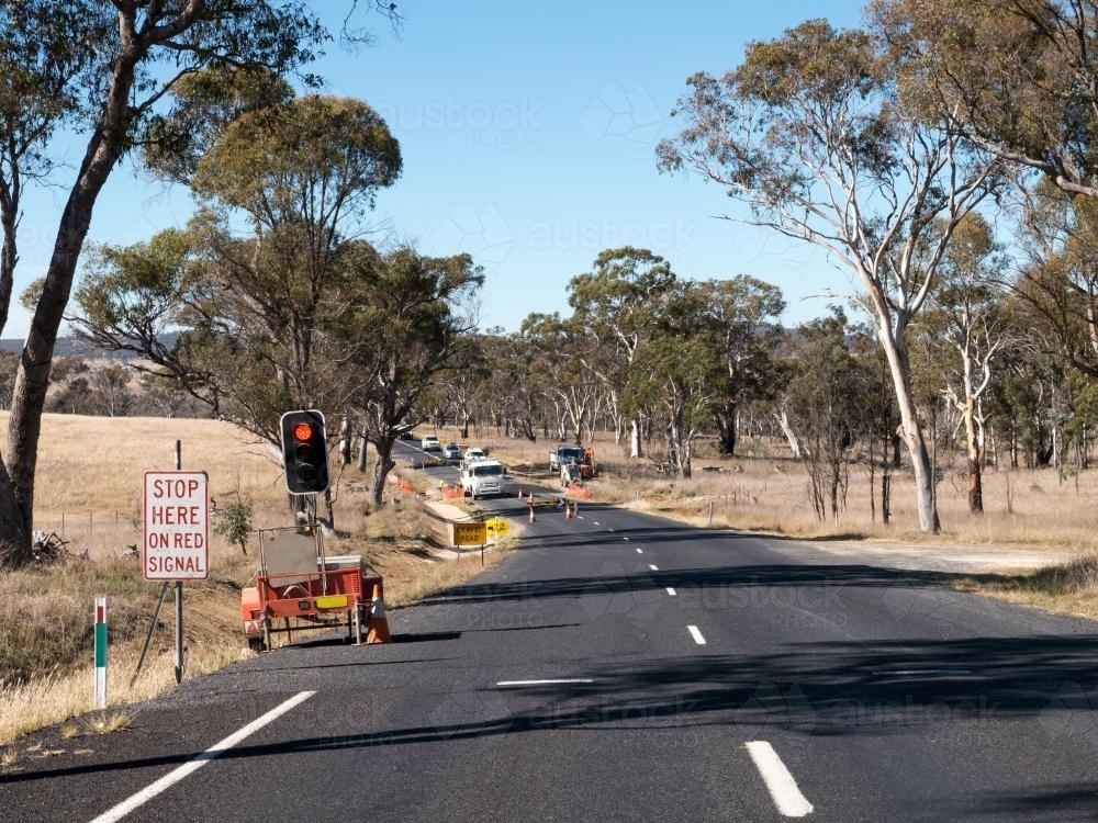 Road works with traffic lights on a country road - Australian Stock Image