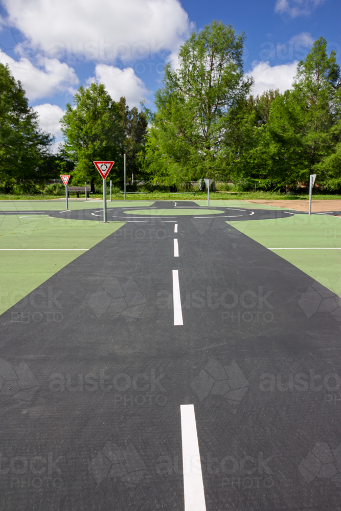Roads, roundabout and give way sign at children’s play park - Australian Stock Image