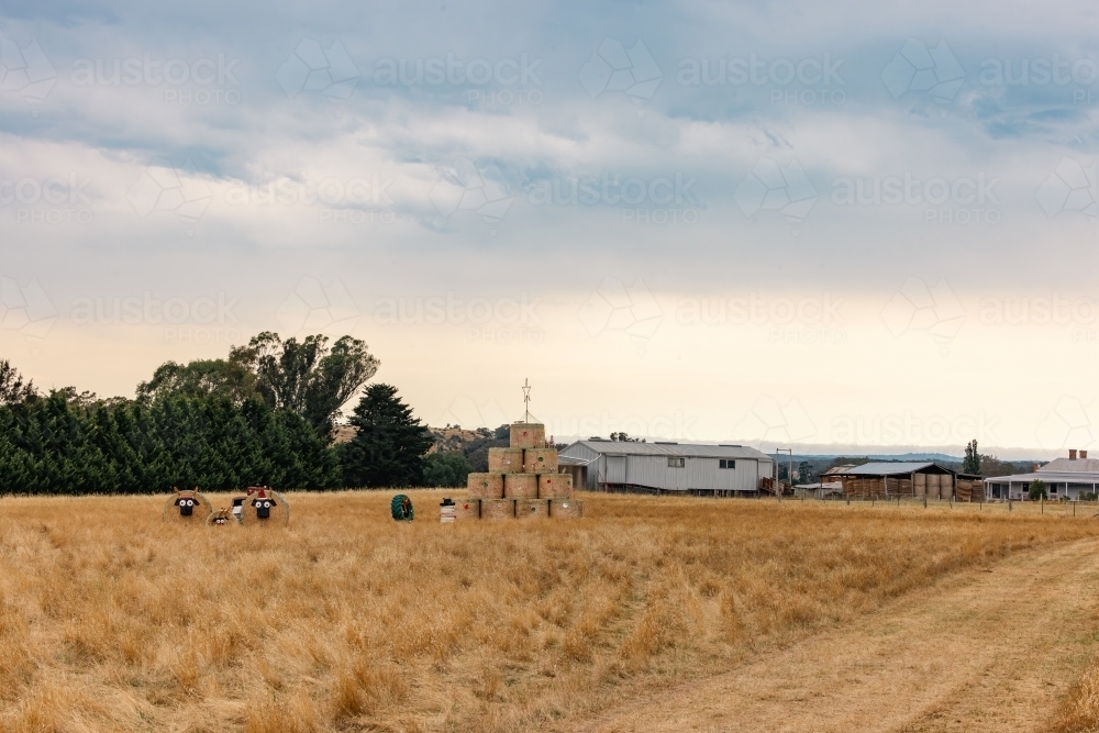 Roadside Christmas decorations made of hay bales in country Victoria - Australian Stock Image