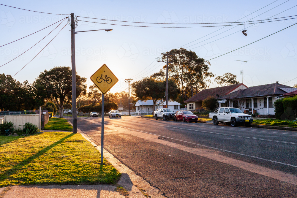 Roadside street sign with bicycle warning for cyclists in the area - Australian Stock Image