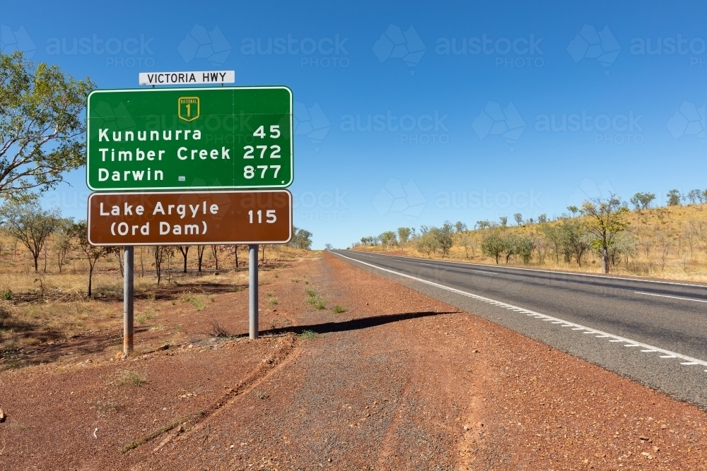 roadside view of road sign near Kununurra on the Victoria Highway - Australian Stock Image