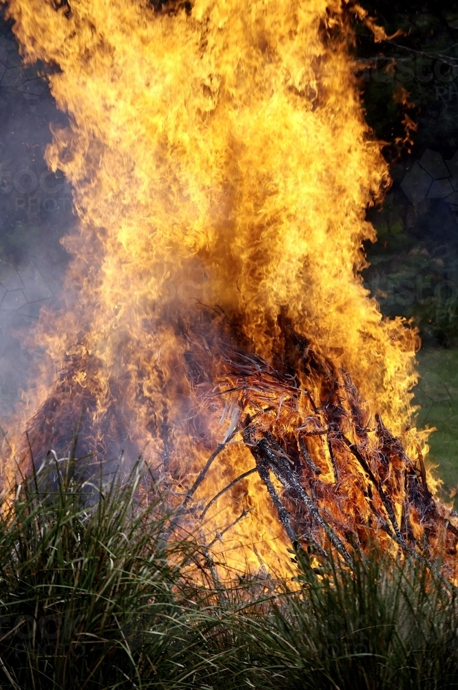Roaring bonfire at a farm during the day - Australian Stock Image