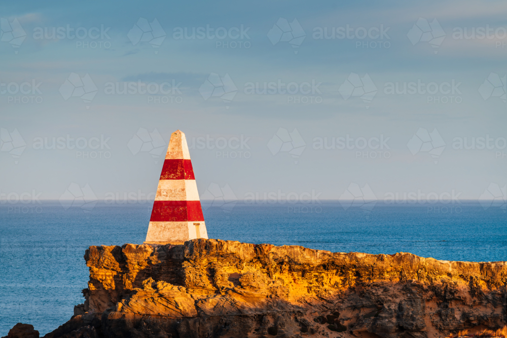 Robe Obelisk during sunrise viewed from the walking trail, Limestone Coast, South Australia - Australian Stock Image