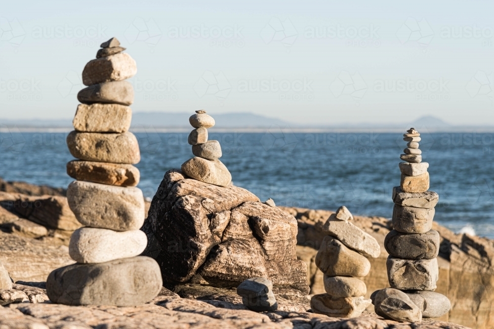 rock balancing by the sea - Australian Stock Image