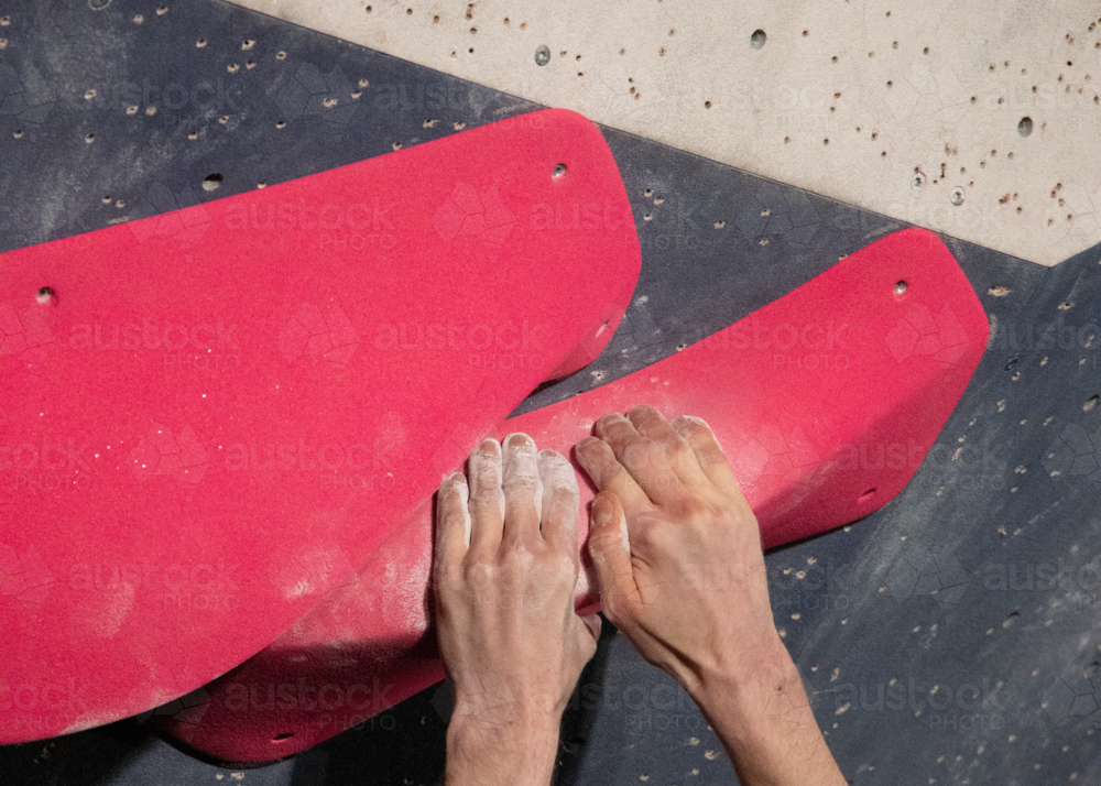 Rock climbing hands male - Australian Stock Image