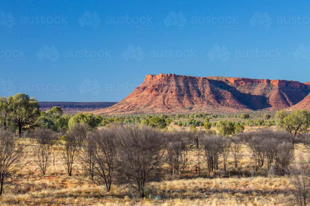 rock geology of Kings Canyon from Kings Canyon Resort at sunset in Northern Territory, Australia - Australian Stock Image