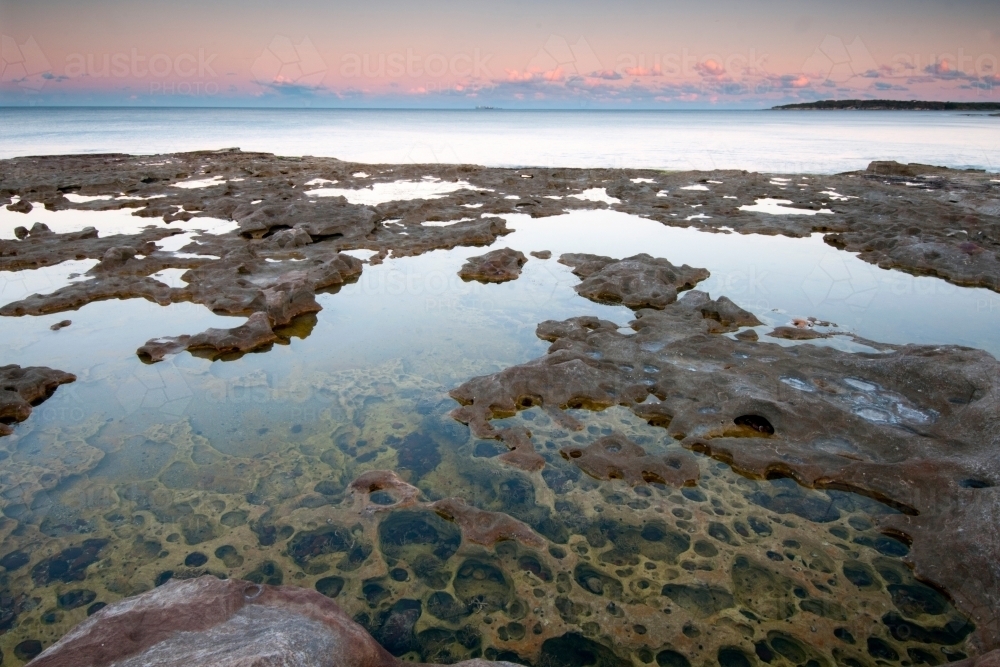 Rock platform pools at sunrise - Australian Stock Image