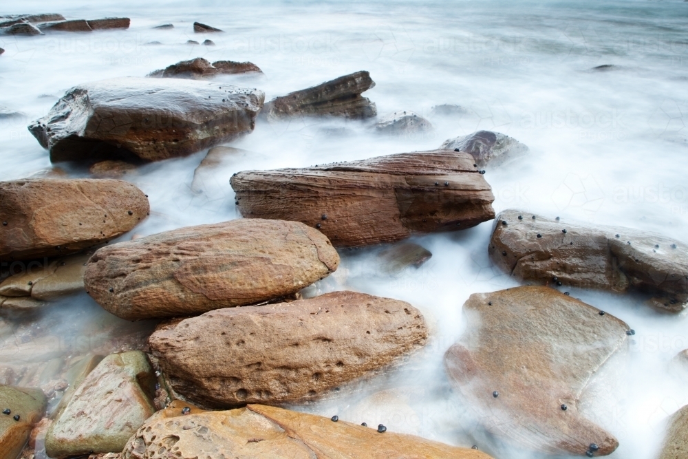Australian Beach Rocks Texture Image of Rocks at the beach - Austockphoto