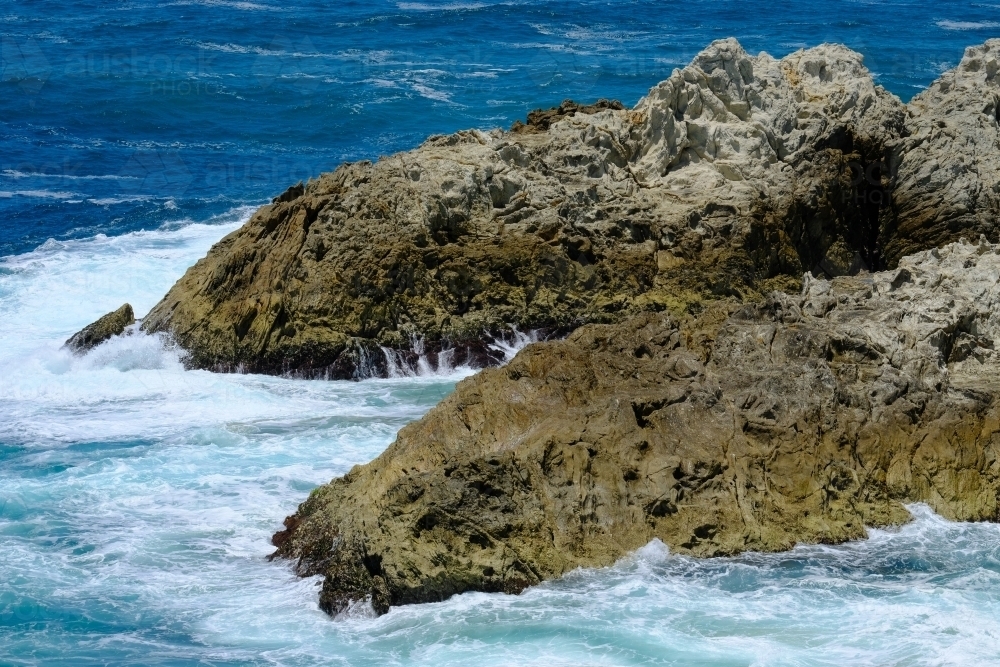 Rocks in the ocean near North Gorge, Straddie - Australian Stock Image