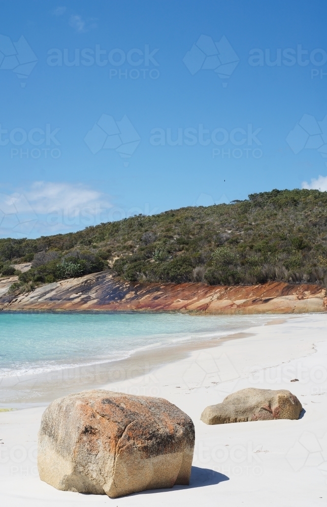 Rocks on the beach in a secluded bay - Australian Stock Image