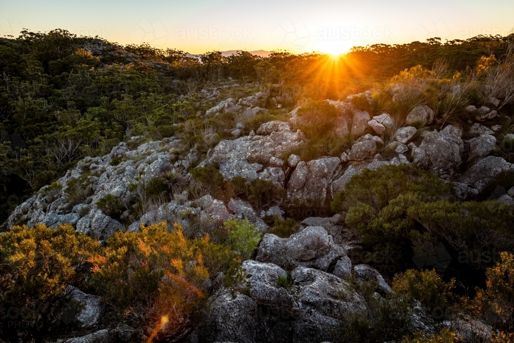 Rocky bushland and sunrise - Australian Stock Image