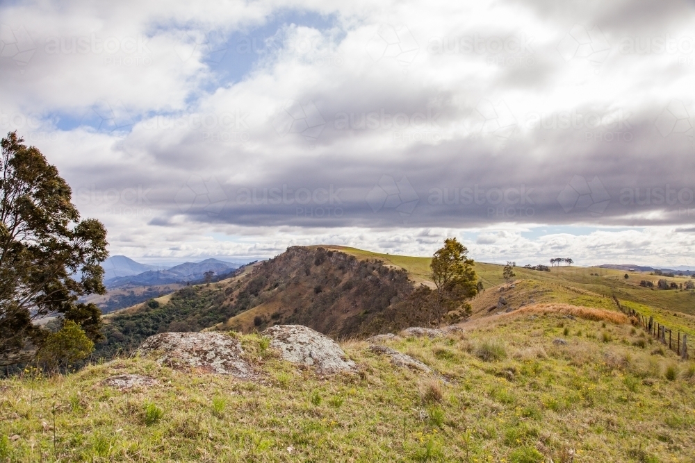 Rocky cliff and hilltop of mountain - Australian Stock Image
