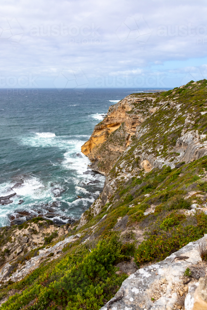 Rocky Cliffs and Crashing Waves near Remarkable Rocks, Kangaroo Island - Australian Stock Image