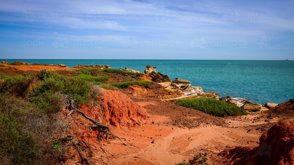 Rocky coastline with ocean and blue sky - Australian Stock Image