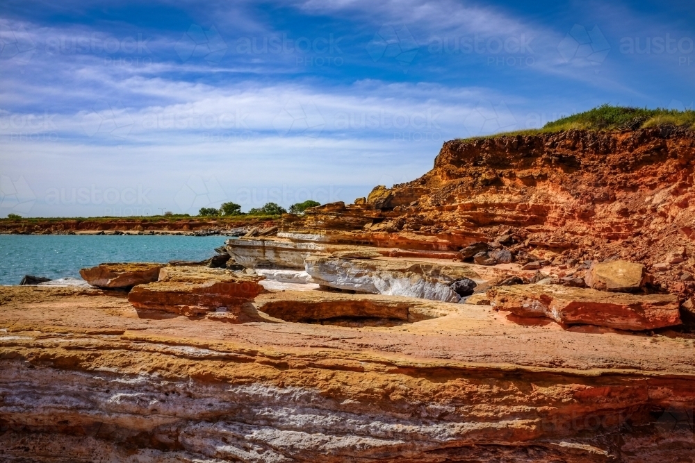 Rocky coastline with ocean and blue sky - Australian Stock Image
