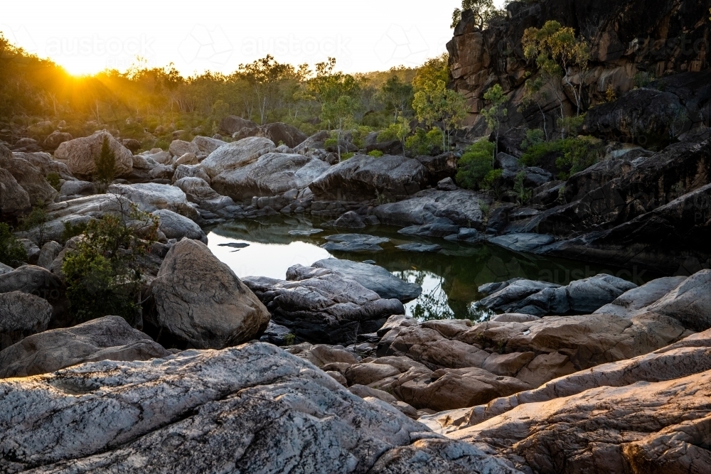 Rocky creek and waterhole at sunset - Australian Stock Image