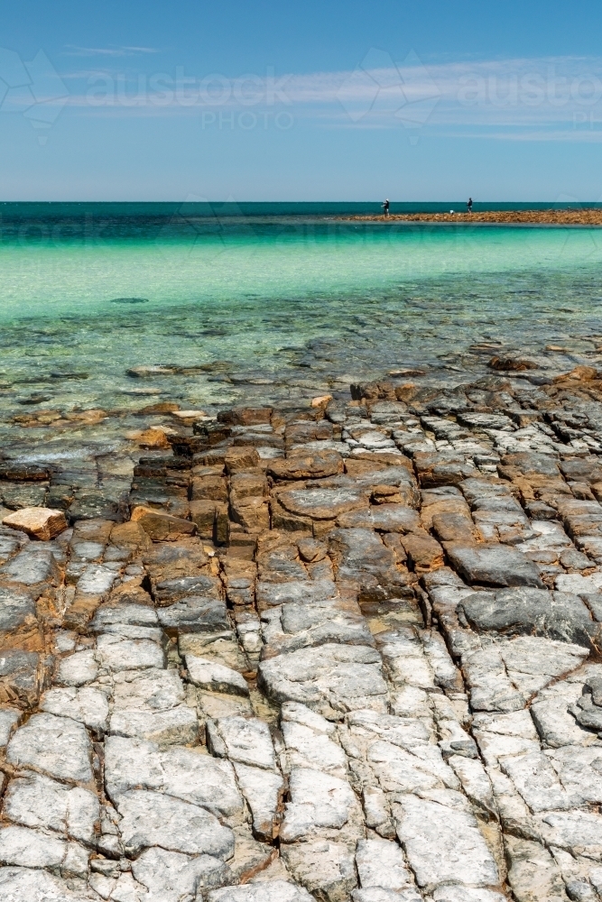 rocky foreshore with turquoise water - Australian Stock Image